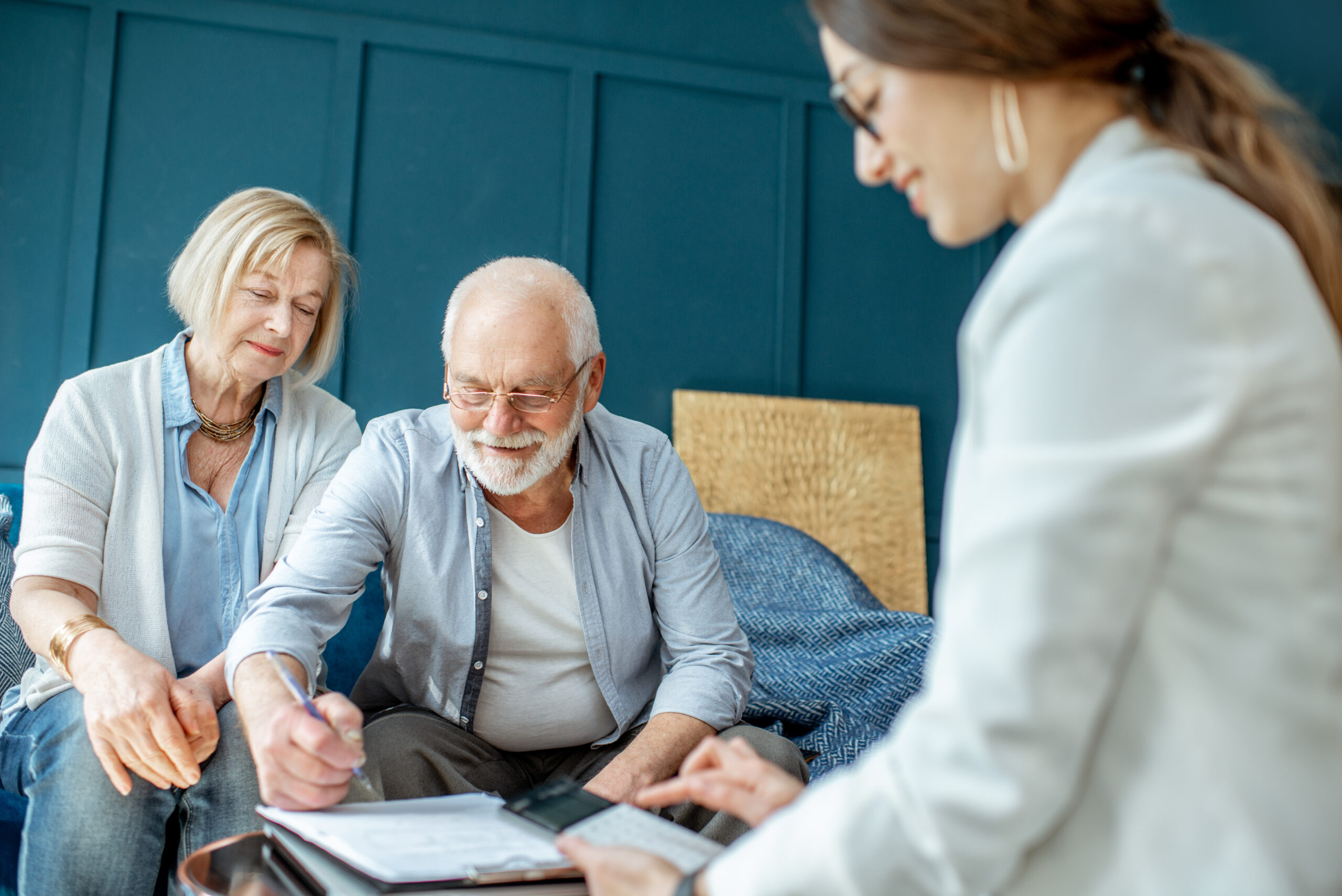 Senior couple consulting with advisor about lifestyle changes and well-being.
