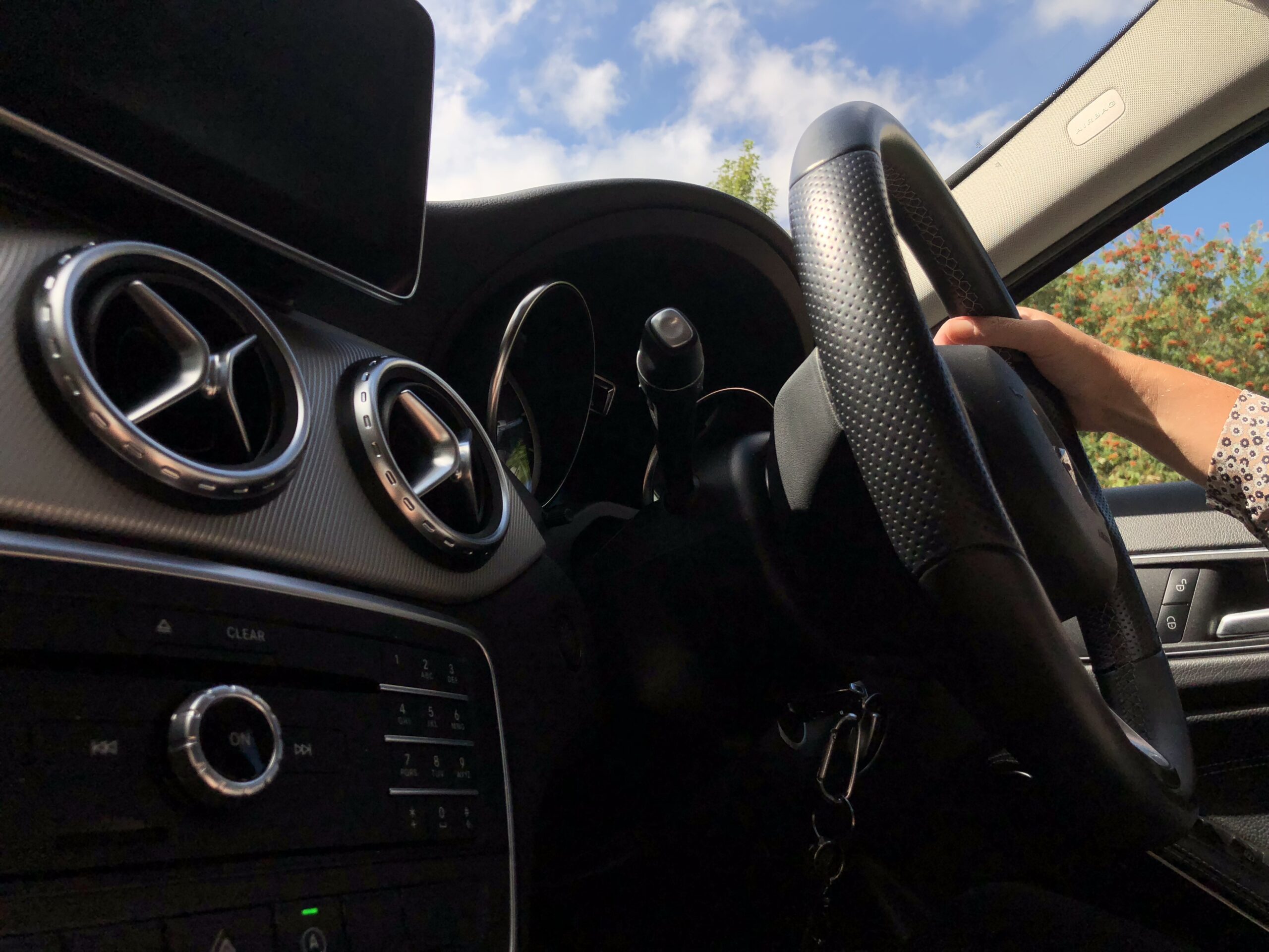 Car interior and steering wheel, suggesting outdoor activities and lifestyle refreshment.