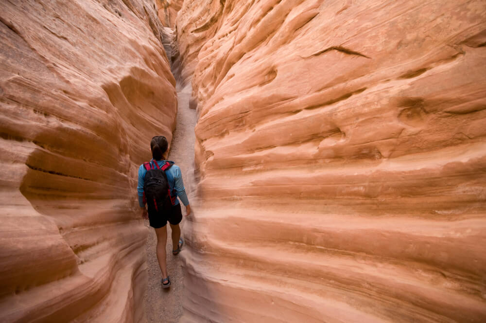 a person walking in a canyon