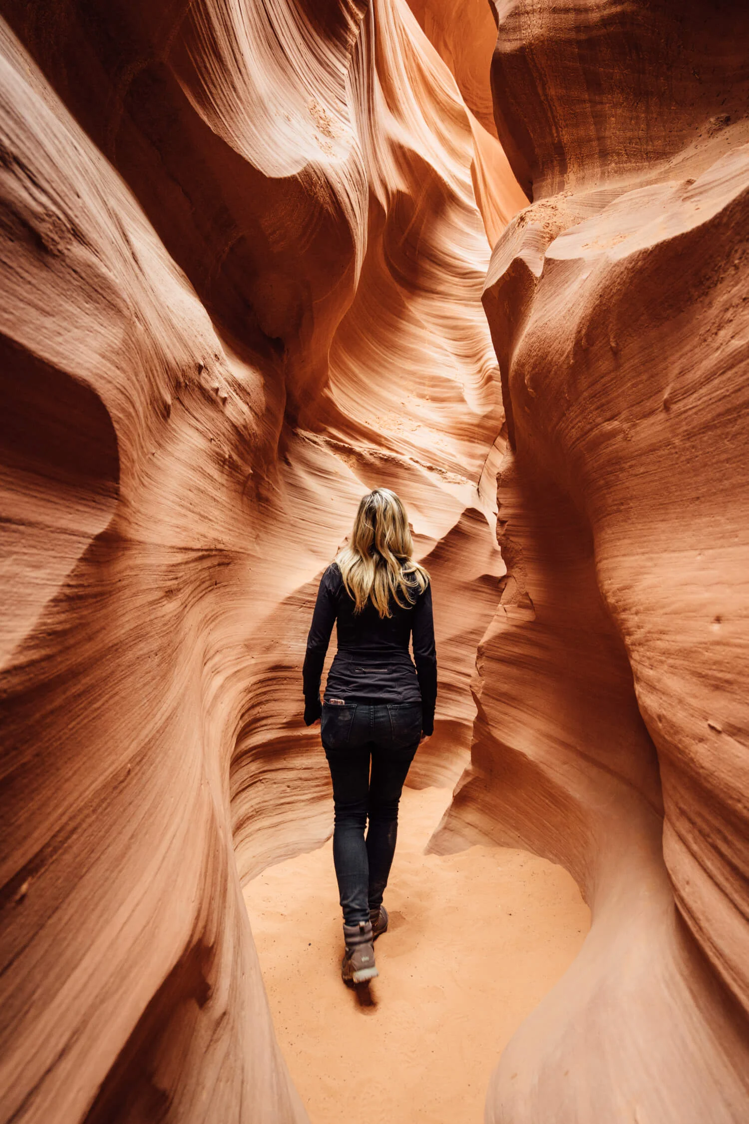 a person walking through a canyon